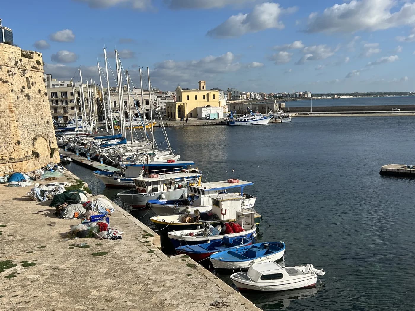 Gallipoli harbour with fishing boats and city view